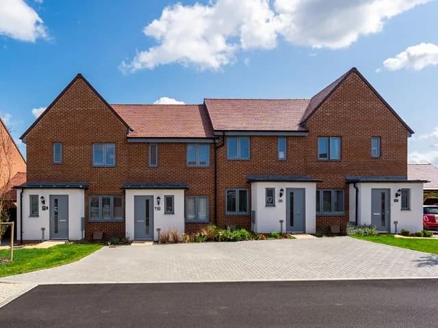 A terrace of new brick homes by Persimmon Homes
